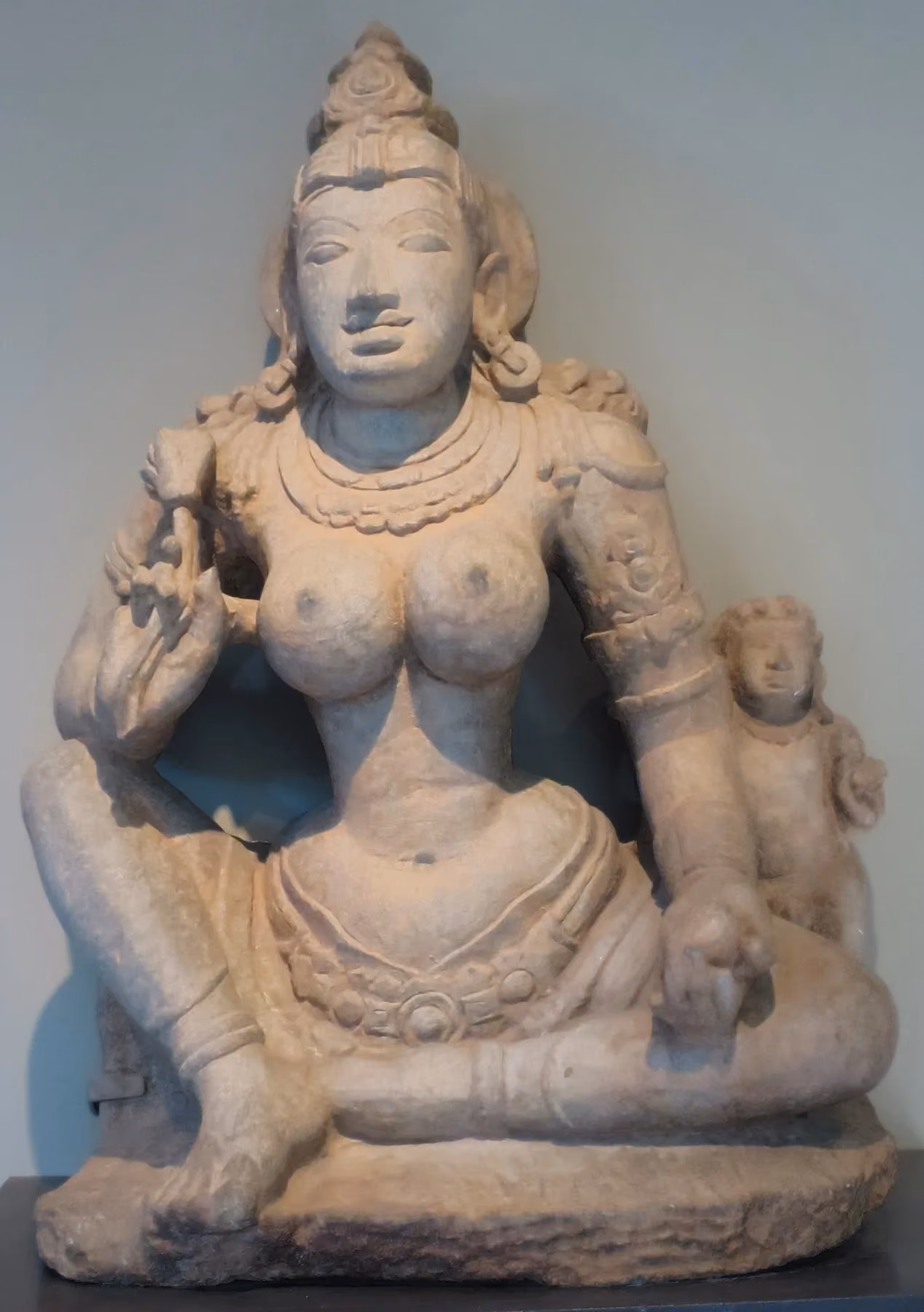 A stone sculpture of the Jain yakshi Kushmandini from Karnataka, carved around the year 900