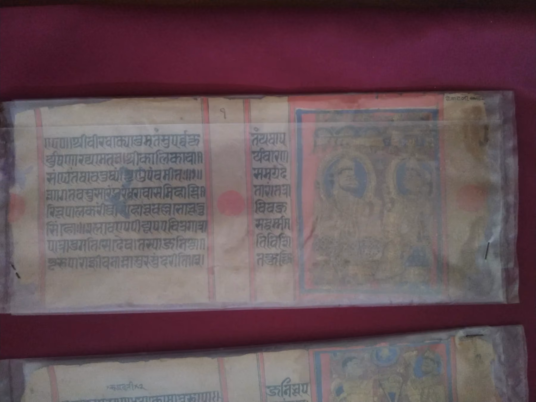 A Jain manuscript folio carrying a miniature painting alongside handwritten script